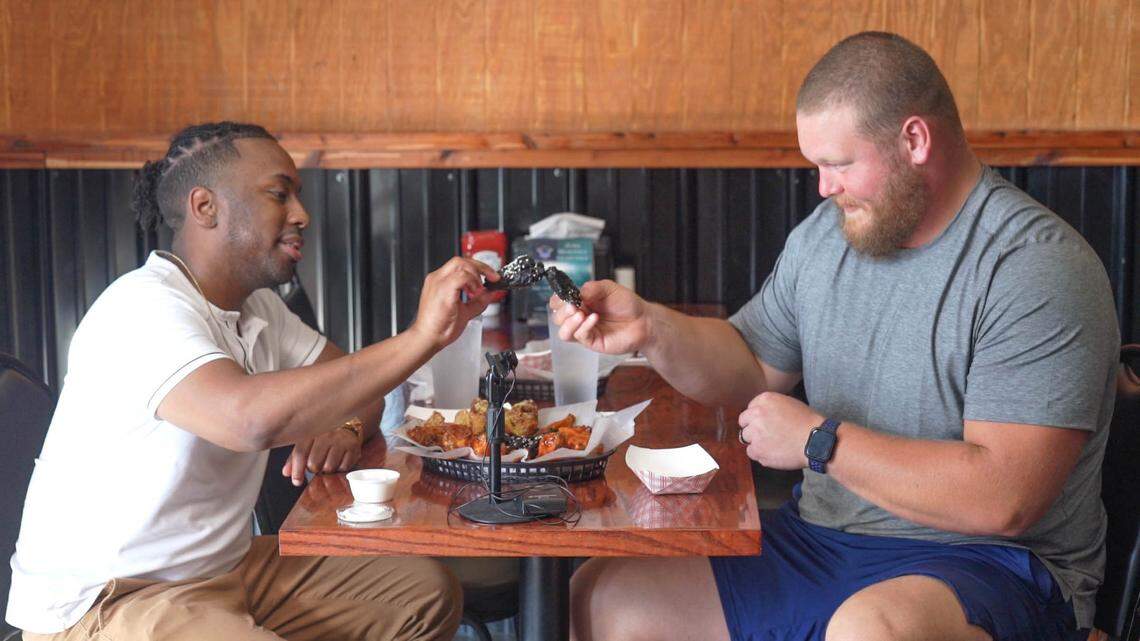 Jonathan Alexander and Bradley Bozeman at Wing King Cafe in Charlotte.