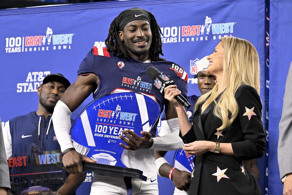 East defensive back O'Donnell Fortune of South Carolina (20) is presented with the defensive MVP trophy after the East defeats the West in the East-West Shrine Bowl at AT&T Stadium in January.
