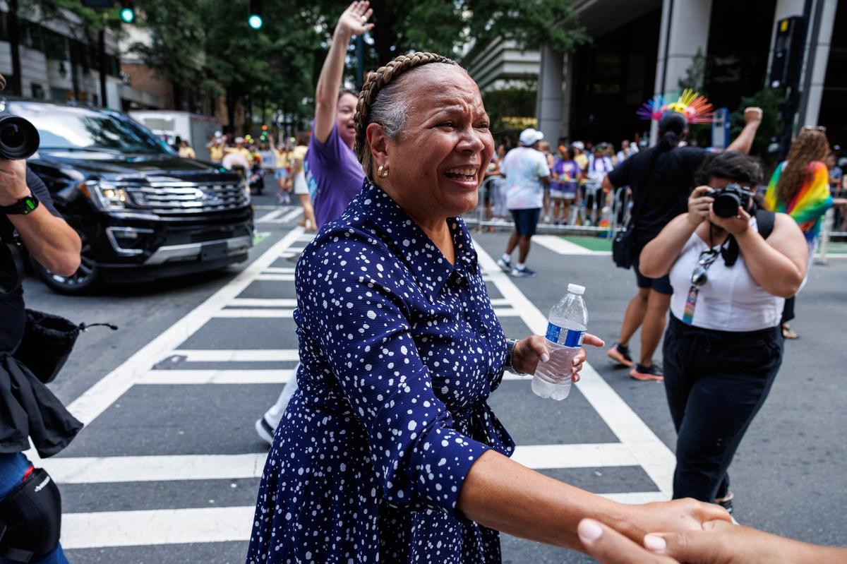Charlotte mayor Vi Lyles smiles and shakes the hand of a parade attendee during the Charlotte Pride Festival & Parade on Sunday, Aug. 18, 2024
