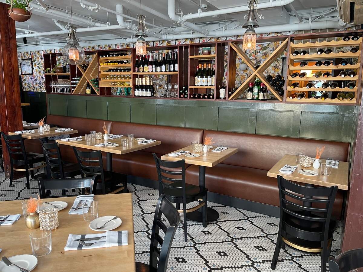 A wall of wines is a focal point inside Ever Andalo.