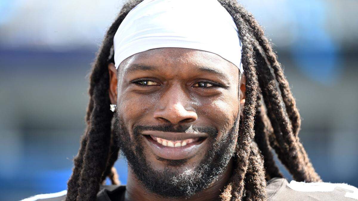 In 2022 in Charlotte, then-Cleveland Browns defensive end Jadeveon Clowney (90) stood on the sidelines in the third quarter at Bank of America Stadium. Clowney joined the Panthers on March 27, 2024, signing a two-year contract.