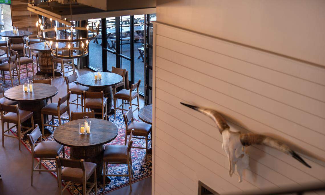 The taproom at Club West Brewing, formerly Sycamore Brewing, in Charlotte is decorated in American West inspiration, which includes repurposing brewery barrels into tables.