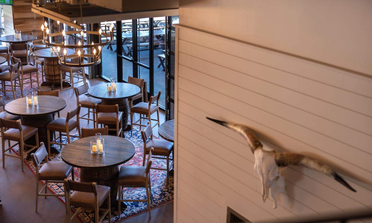 The taproom at Club West Brewing, formerly Sycamore Brewing, in Charlotte is decorated in American West inspiration, which includes repurposing brewery barrels into tables.
