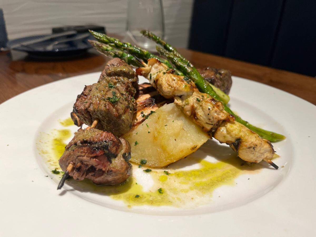 The mixed grill at Yassou Grill is lamb, chicken and filet with roasted vegetables.