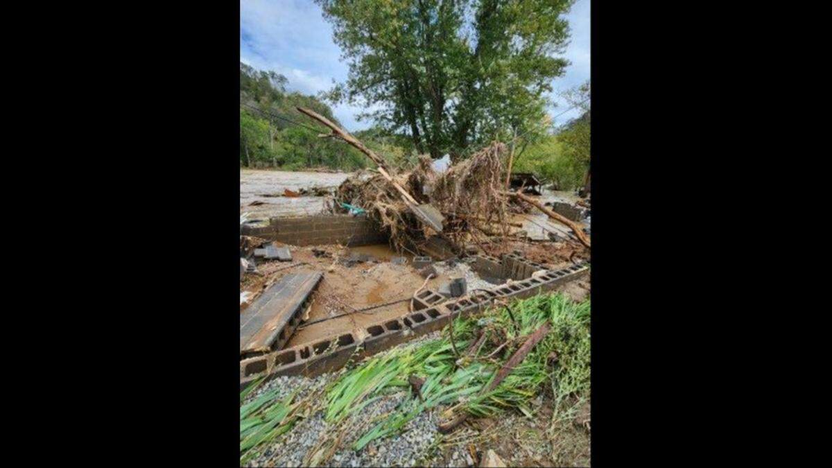 Debris from Tropical Storm Helene covers the foundation that once supported Tammy Coates’ home in Marshall. The storm washed the house into the French Broad River.