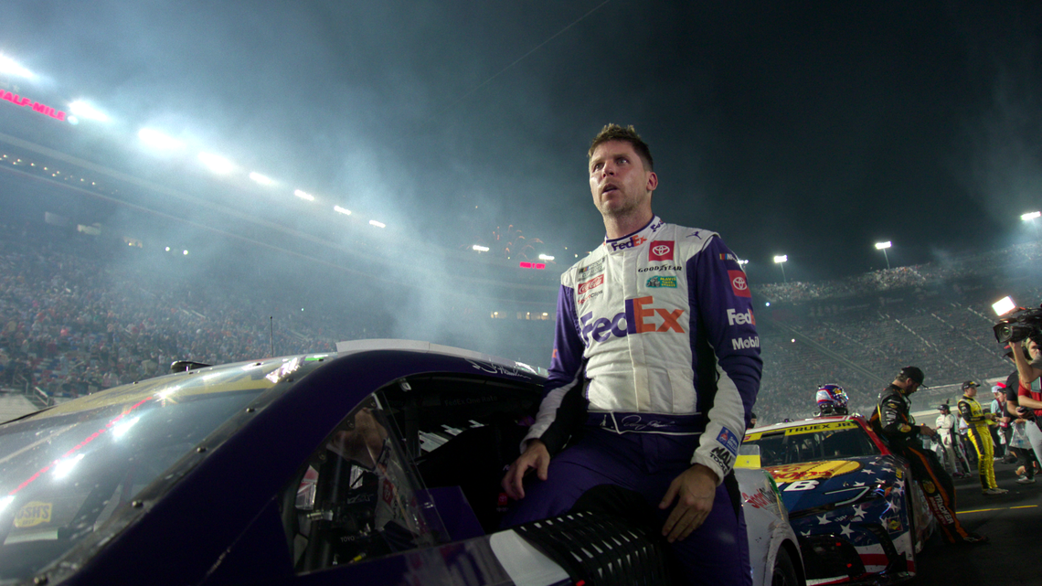 NASCAR driver and owner Denny Hamlin climbs out of his race car at Bristol Motor Speedway in Season 2 of Full Speed.