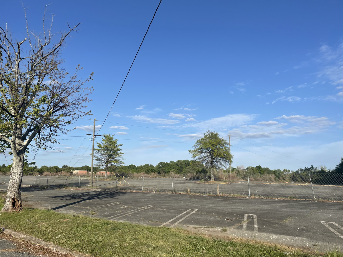 A parking lot at the old Eastland Mall site in Charlotte on April 2021, 2022. Eighteen months ago, the City of Charlotte and Tepper Sports & Entertainment announced plans to redevelop the land but it remains untouched.