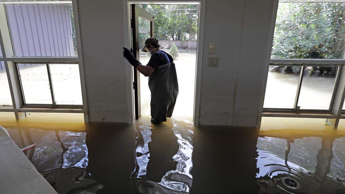 Hurricane Harvey flooded homes in Houston's floodplains last August. Three to four Atlantic hurricanes should make landfall this year, AccuWeather says, compared to the six storms that hit the U.S., including Puerto Rico and the Virgin Islands, last year.
