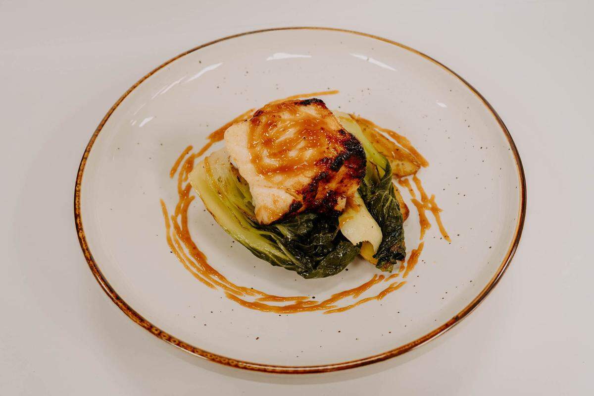 16 Prime’s Chilean sea bass with miso sake glaze, roasted potatoes and sauteed bok choy.