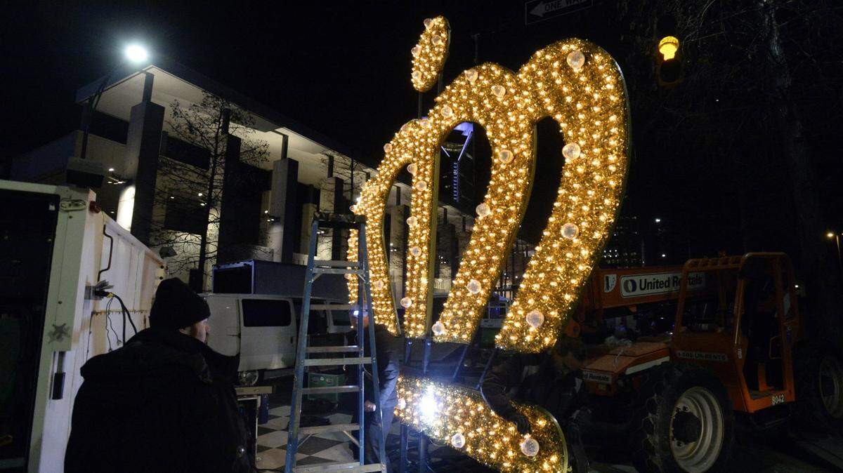 Workers test the lights on a crown backstage at Charlotte’s New Year’s celebration in this file photo. During the city’s 2025 New Year’s Eve celebrations in uptown, police made fewer arrests than in 2024.