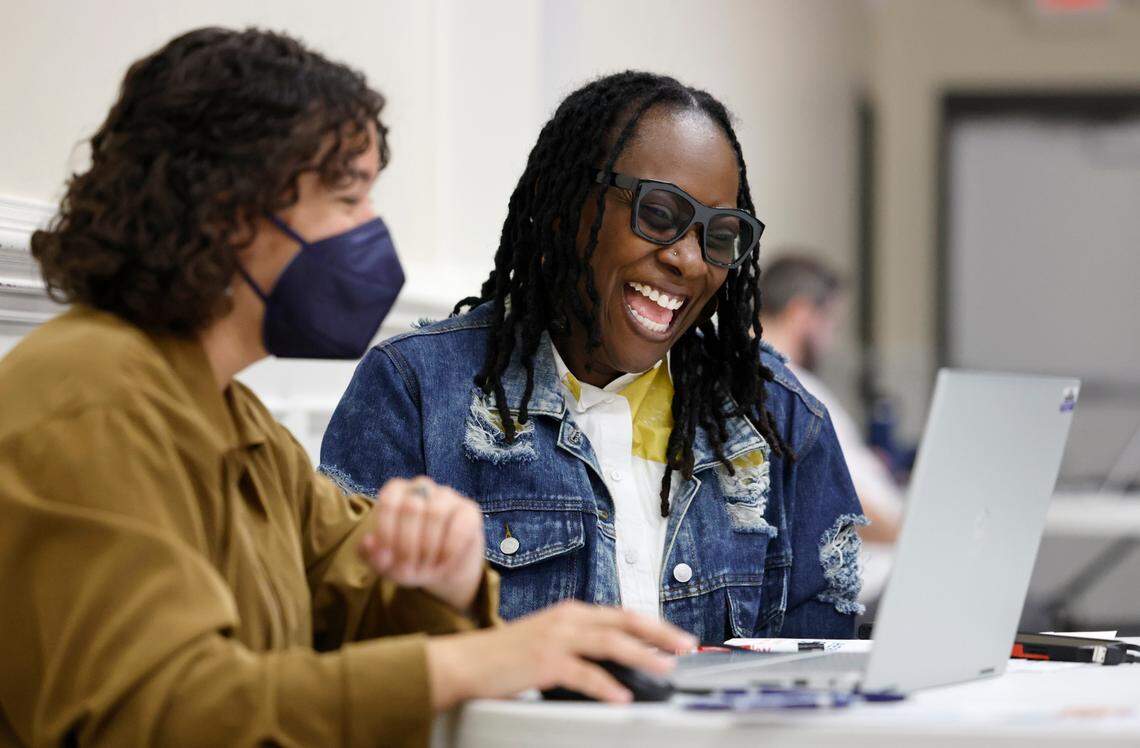 Jacqueline Speller, right, works with navigator Judith Rivera to enroll in insurance during a Wake County ACA and Medicaid enrollment event at Martin Street Baptist Church in Raleigh, N.C., Friday, Dec. 1, 2023.