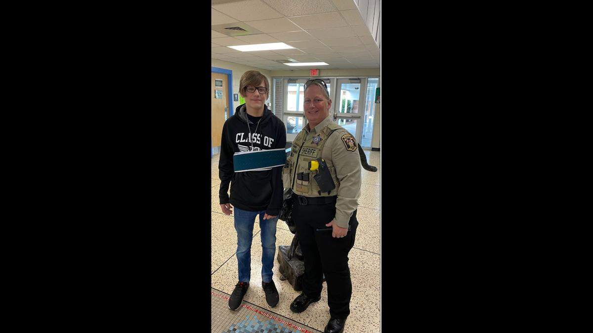 Deputy C. Baucom with Matthew Carter together at Piedmont High School on Thursday.