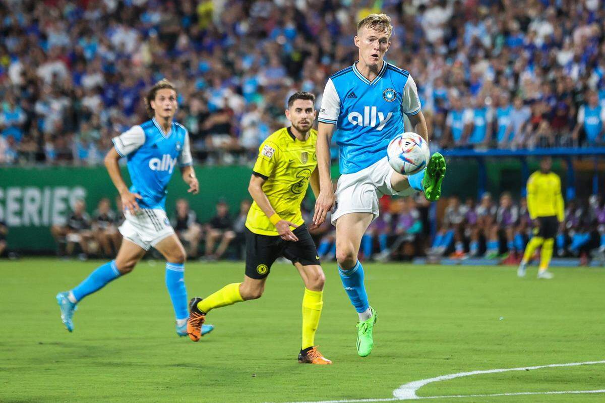 Charlotte FCs Karol Swiderski, right, extends for a kick toward a pass during the match against Chelsea FC at Bank of America Stadium on Wednesday, July 20, 2022 in Charlotte, NC.