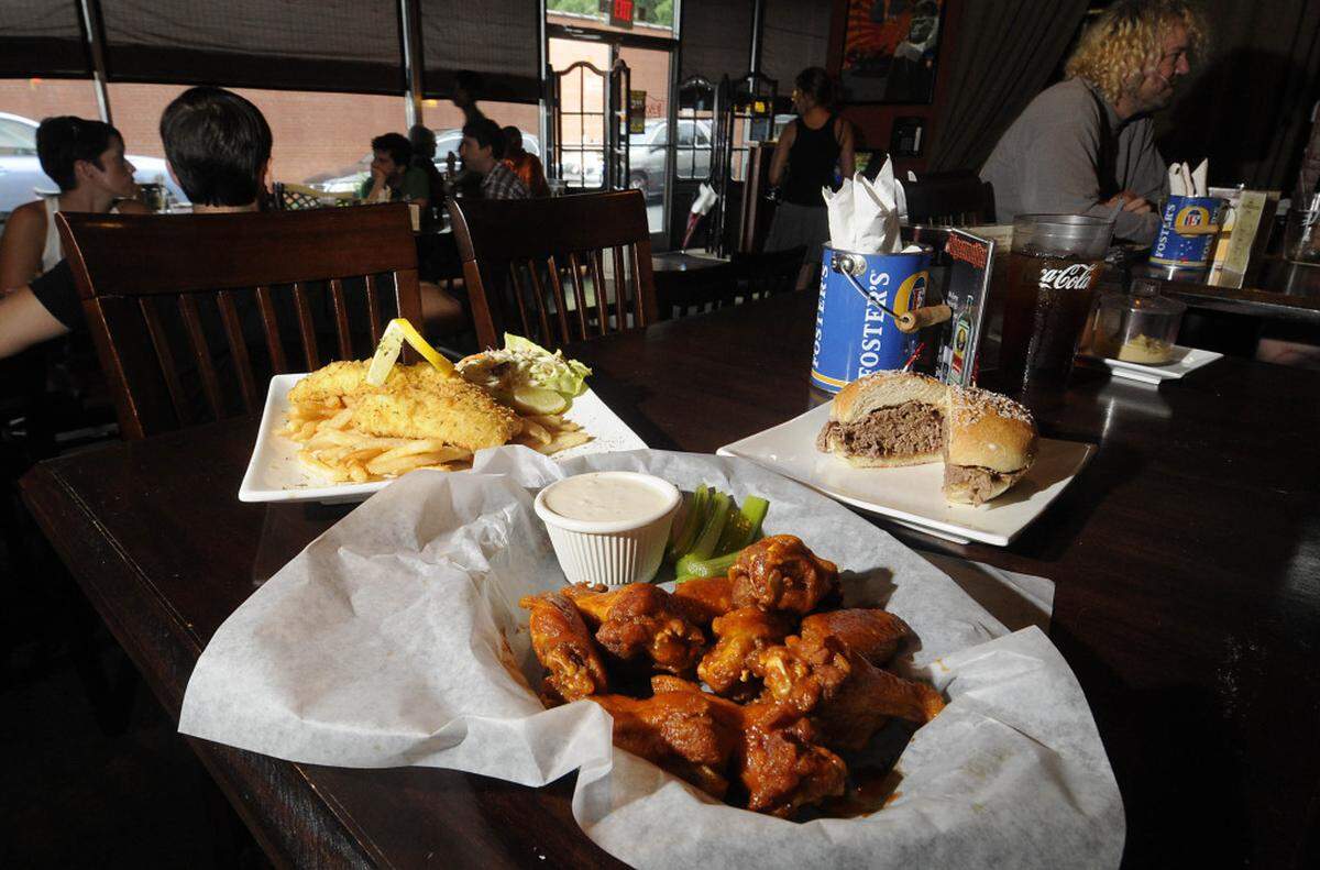 8/15/10 Several of Lebowski's Neighborhood Grill's signature dishes including fried haddock (left), buffalo wings, and beef on weck. DAVID T. FOSTER III - dtfoster@charlotteobserver.com