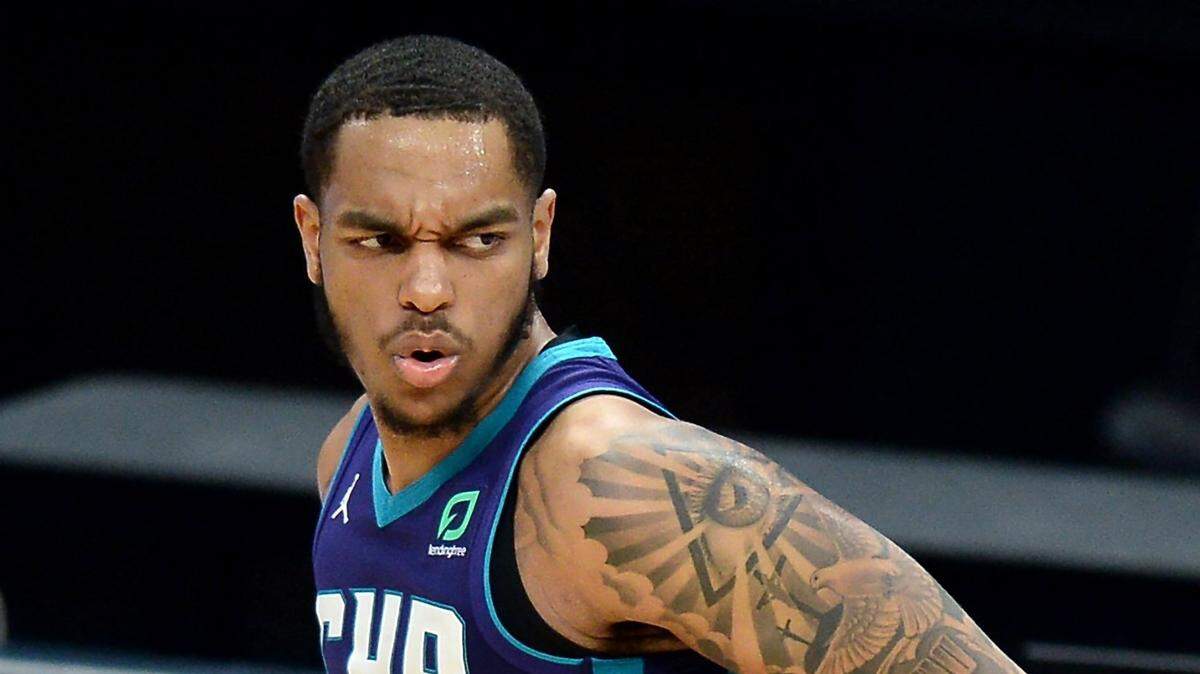Charlotte Hornets forward PJ Washington glances back down court after hitting a three-pointer during second half action against the Detroit Pistons at Spectrum Center in Charlotte, NC on Thursday, March 11, 2021. The Hornets defeated the Pistons 105-102.