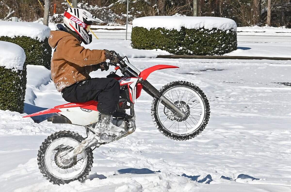 A dirt bike enthusiast enjoys the fresh snow on Sunday, February 1, 2026.