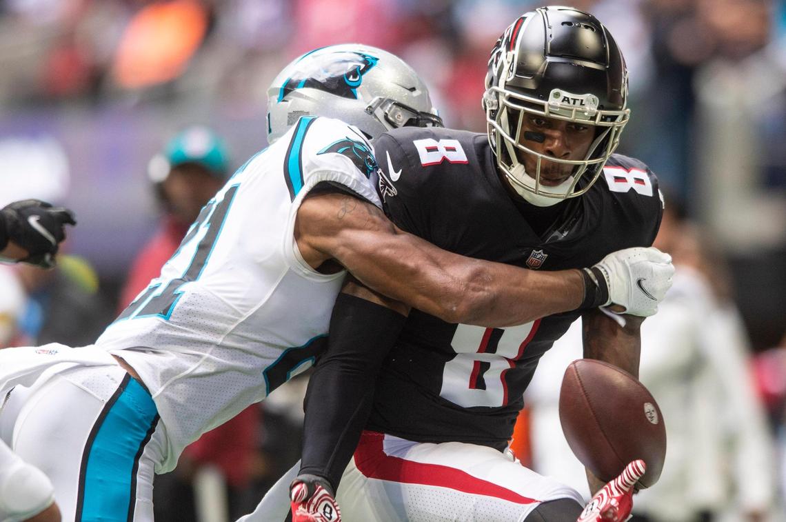 Falcons tight end Kyle Pitts reacts as the ball is knocked out of his hand as Panthers safety Jeremy Chinn breaks up the pass during the game at Mercedes-Benz Stadium on Sunday, October 31, 2021 in Atlanta, GA.