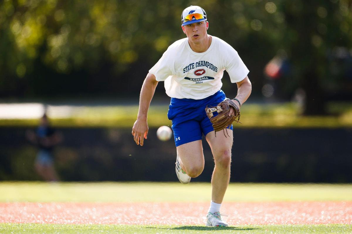 Charlotte Christian’s Judd Utermark fields a ball during practice at Charlotte Christian School in Charlotte, N.C., Wednesday, April 27, 2022. This season Utermark broke a 22-year old school record for home runs and as of Monday, April 25 he leads the nation win home runs.