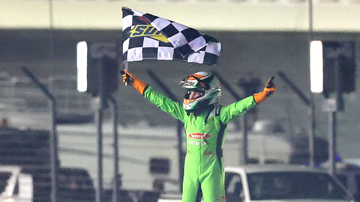 Brexton Busch stands atop the No. 8 Lucas Oil Chevrolet that his father, Kyle Busch drove during his NASCAR Cup Series