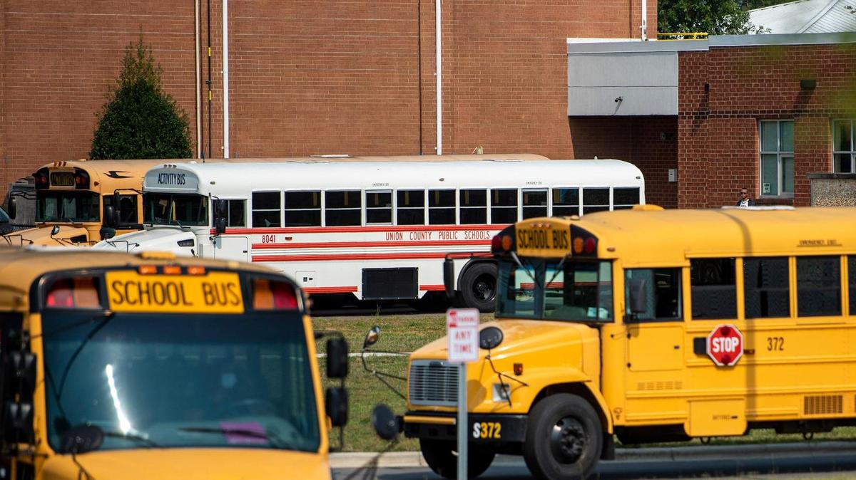 Union County Public Schools is being sued after opting to start the year earlier than the state allows. Here, an activity bus is seen as school buses arrive to pick up students at the end of the school day at Sun Valley High School on Monday, September 13, 2021.