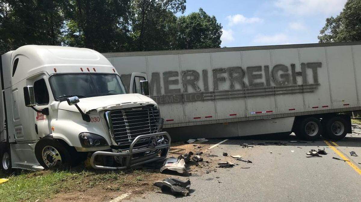 At least one person is dead and portion of a road in Cabarrus County is shut down Tuesday afternoon due to a crash involving a tractor-trailer.