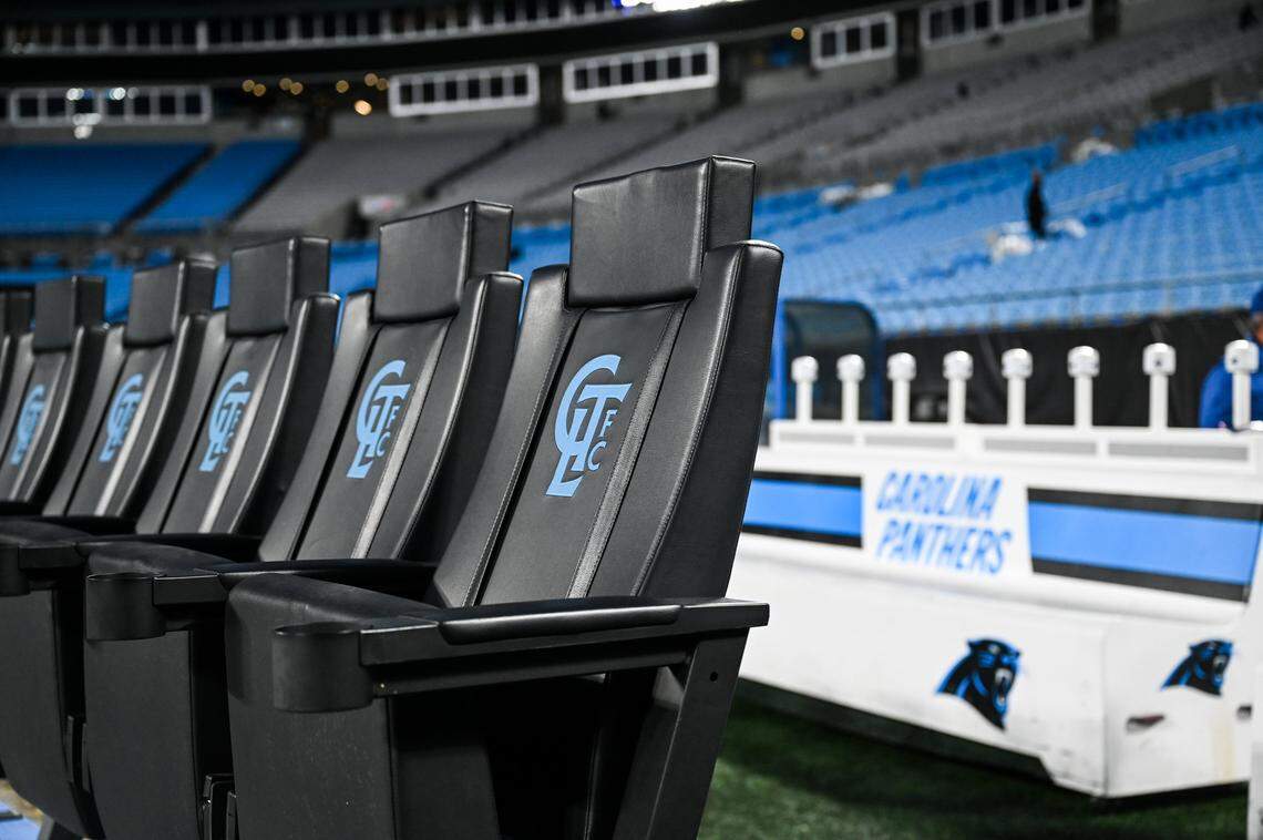 Seating for MLS players sits in front of player NFL player benches as the stadium operations crew transitions the field from NFL to MLS at Bank of America Stadium in Charlotte, NC on Sunday, October 26, 2025.
