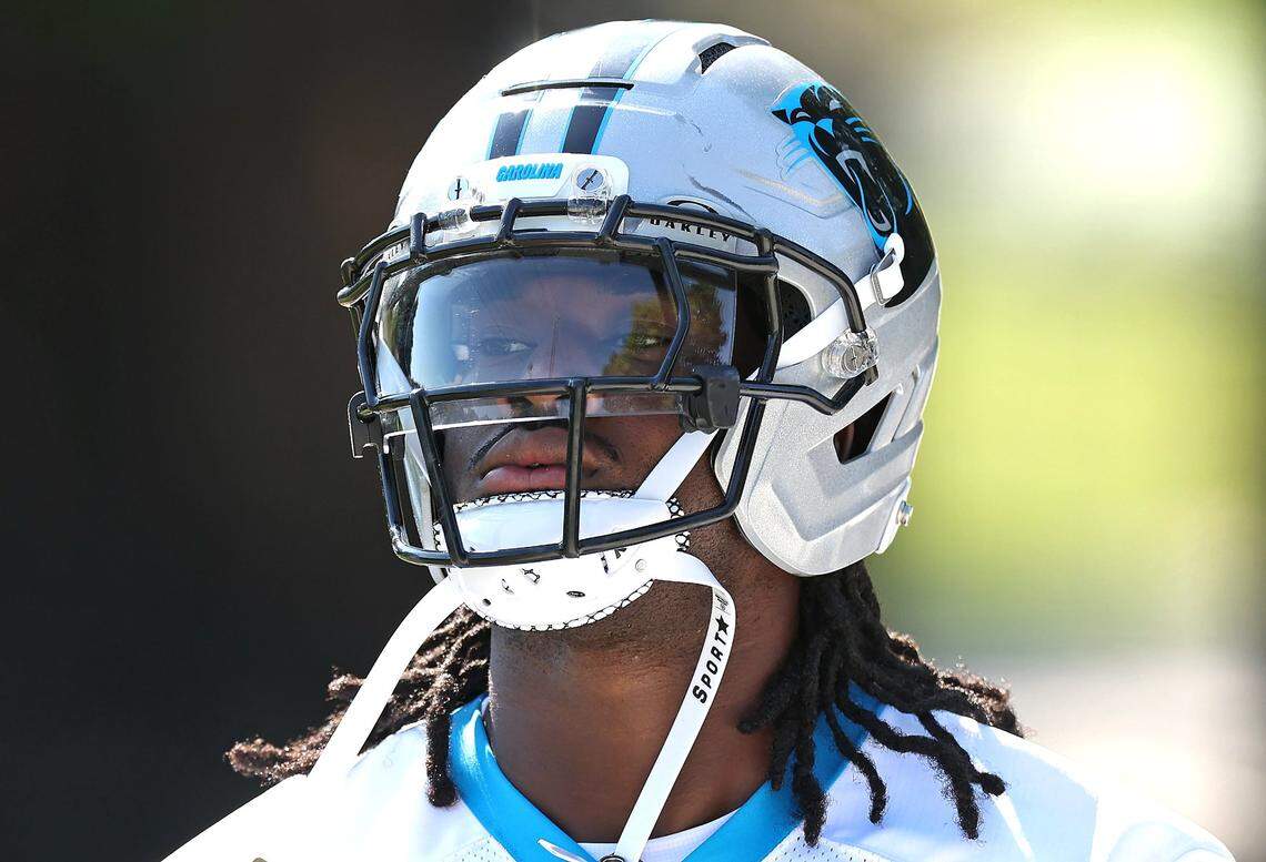 Carolina Panthers linebacker Princely Umanmielen walks to the team’s training camp practice on Wednesday, July 23, 2025.