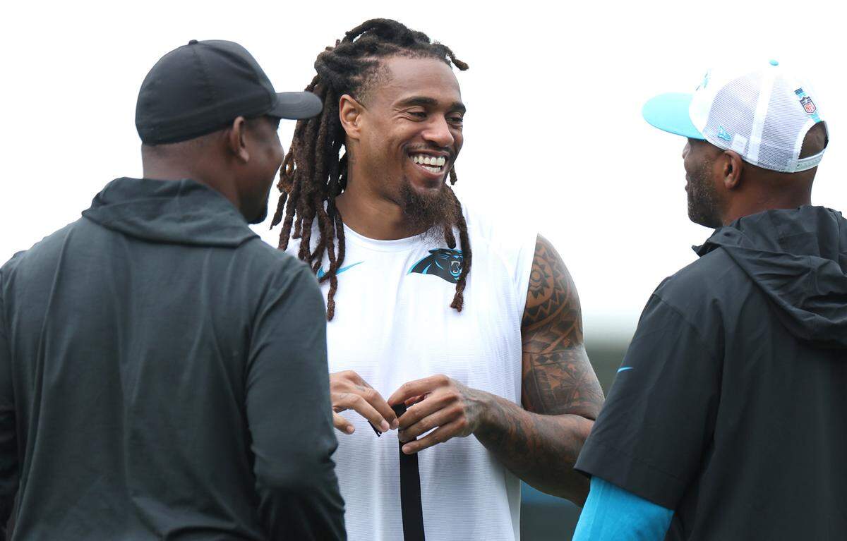 Carolina Panthers linebacker Shaq Thompson enjoys time with team personnel prior to training camp practice on Thursday, July 25, 2024.