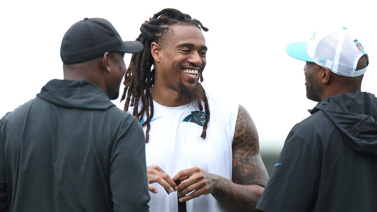 Carolina Panthers linebacker Shaq Thompson enjoys time with team personnel prior to training camp practice on Thursday, July 25, 2024.