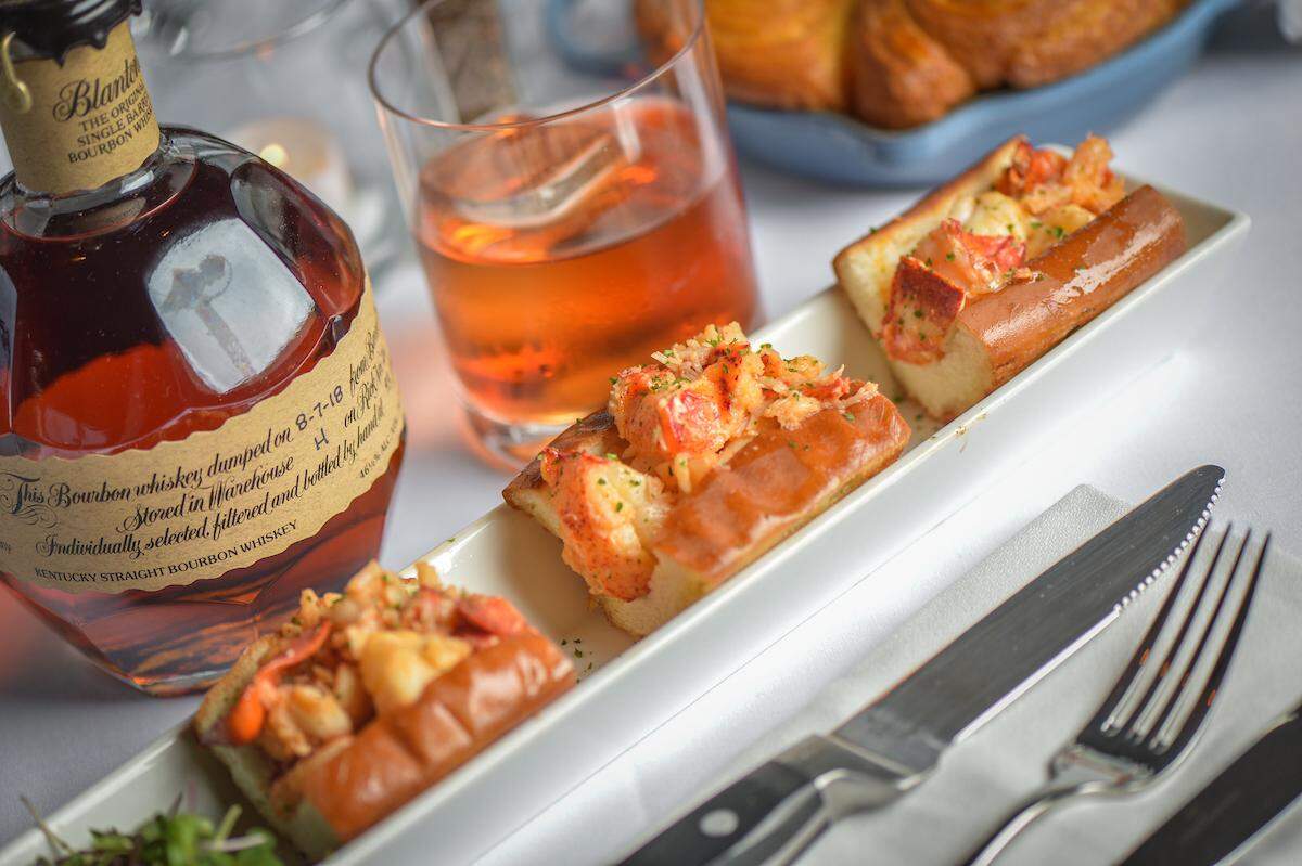 Steak 48 has multiple lobster offerings, including lobster rolls with Maine lobster, butter poached, served on a grilled New England roll.