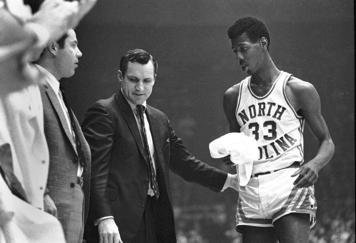 UNC’s Charlie Scott with coach Dean Smith during the 1969 ACC championship game between the Tar Heels and the Duke Blue Devils.
