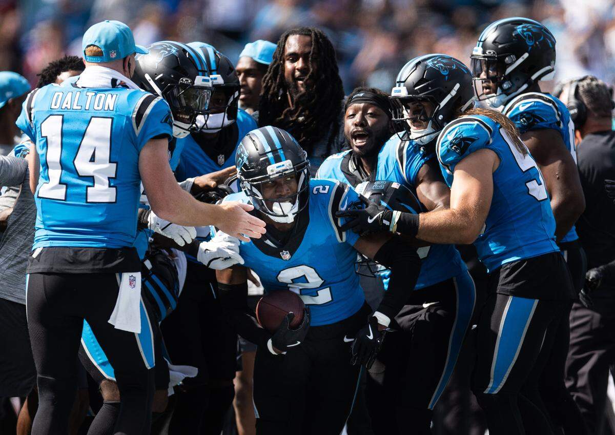 Carolina Panthers cornerback Mike Jackson, center, celebrates an interception against the Atlanta Falcons at the Bank of America Stadium in Charlotte, N.C., on Sunday, September 21, 2025.