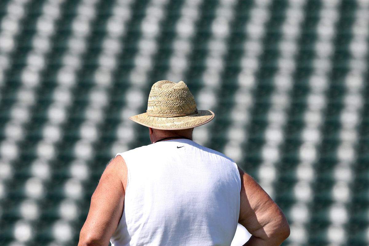 Charlotte 49ers head coach Biff Poggi watches as players move through drills during the team’s first summer training camp practice on Friday, August 3, 2024.