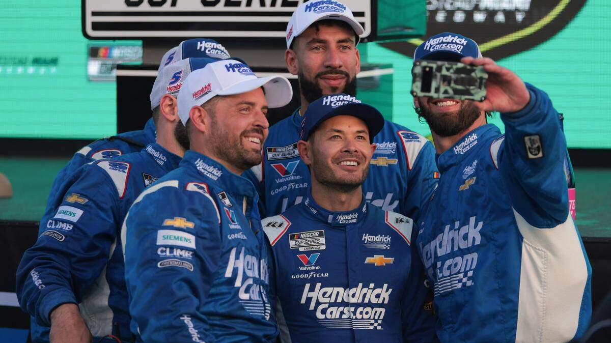 Mar 23, 2025; Homestead, Florida, USA; NASCAR Cup Series driver Kyle Larson (5) celebrates with teammates after winning the Straight Talk Wireless 400 at Homestead-Miami Speedway.