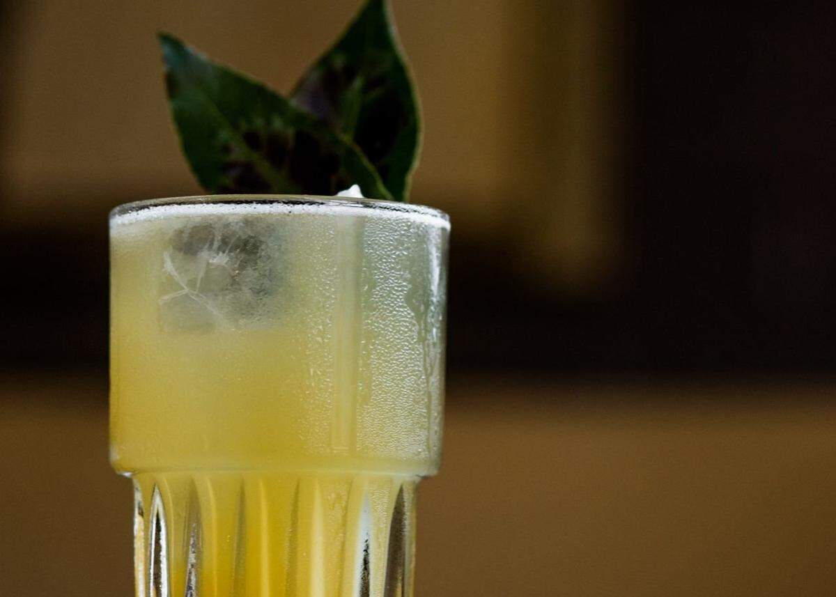 Barcelona Wine Bar’s Bees & Bays is a zero-proof drink with lime, salted honey syrup and cardamom, topped with sparkling water and garnished with torched bay leaves.