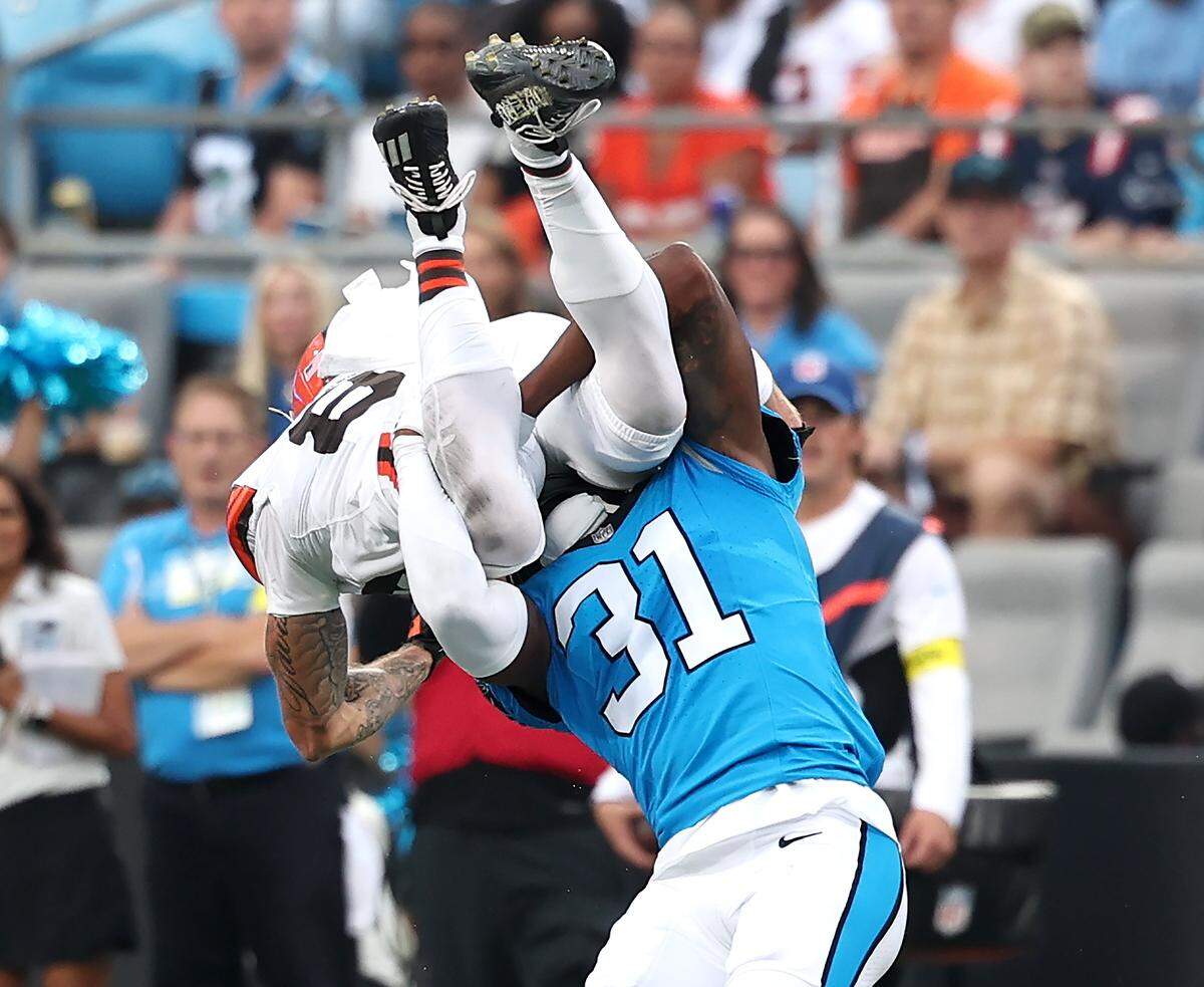 Carolina Panthers cornerback Corey Thornton, right, upends Cleveland Browns wide receiver Kaden Davis, left, during action on Friday, August 8, 2025 at Bank of America Stadium in Charlotte, NC.
