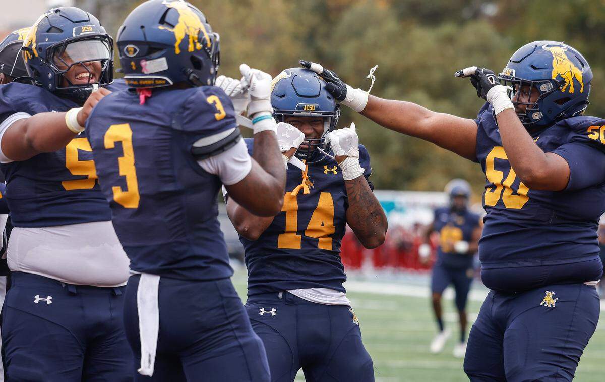 JCSU wide receiver Deandre Proctor, second from right, celebrates scoring a touchdown with teammatesduring the game against WSSU at Eddie C. McGirt Field in Charlotte, NC on Saturday, October 25, 2025.