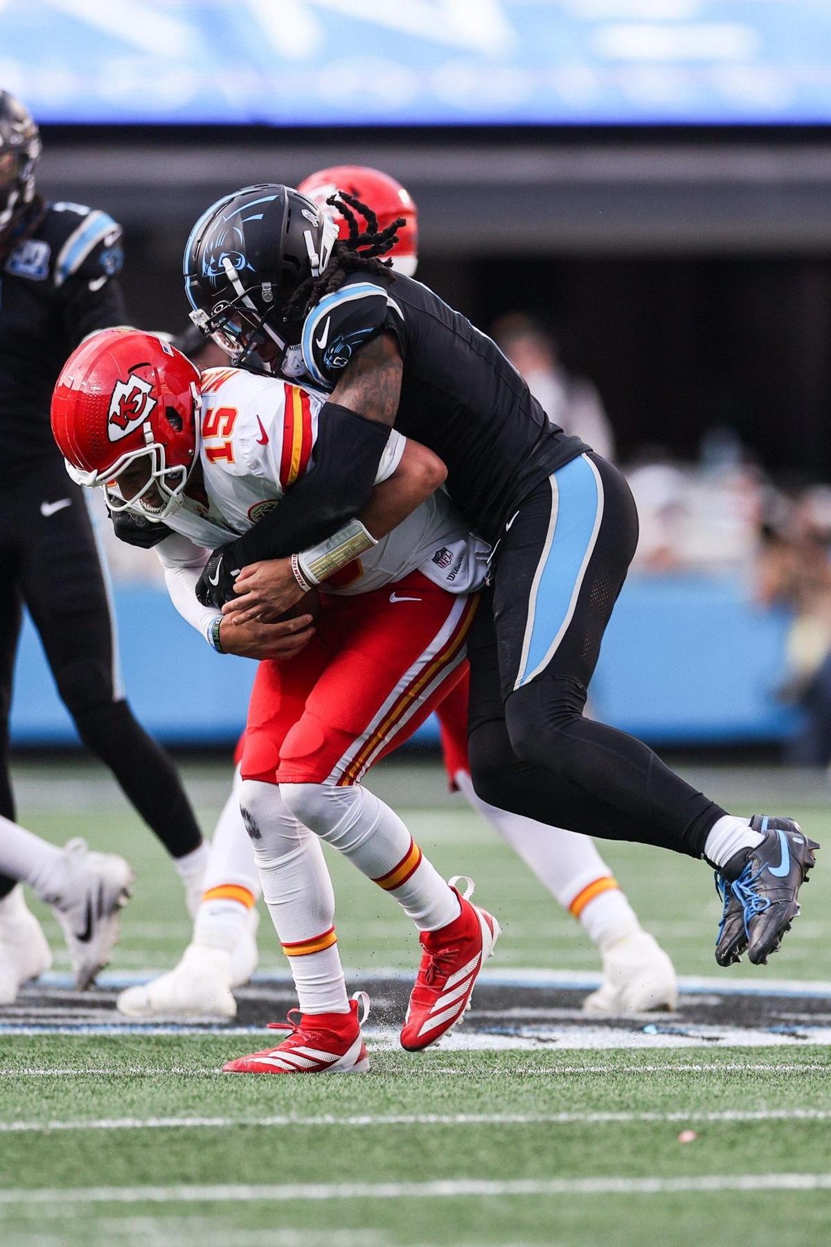 Panthers cornerback Jaycee Horn, right, sacks Chiefs quarterback Patrick Mahomes during the game at Bank of America Stadium in Charlotte, NC on Sunday, Nov. 24, 2024.