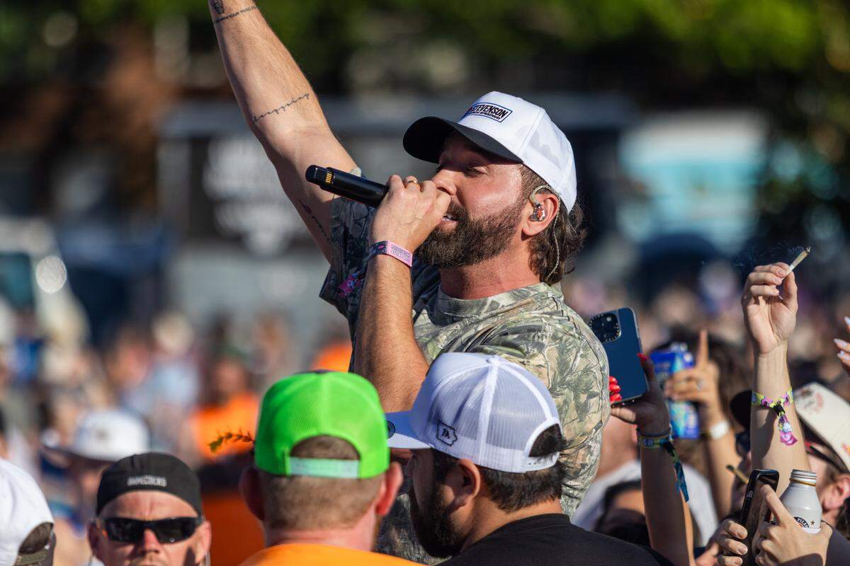 mike. performs in a crowd of fans at Lovin’ Life Music Fest.