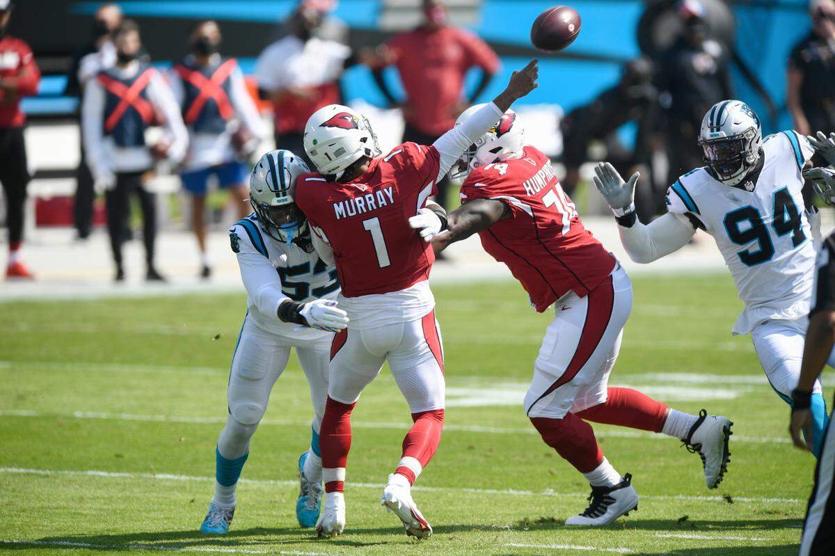 Carolina Panthers defensive end Brian Burns (53) hits Arizona Cardinals quarterback Kyler Murray (1) as he throws in 2020. Carolina won that game, 31-21, and has beaten the Cardinals six consecutive times.