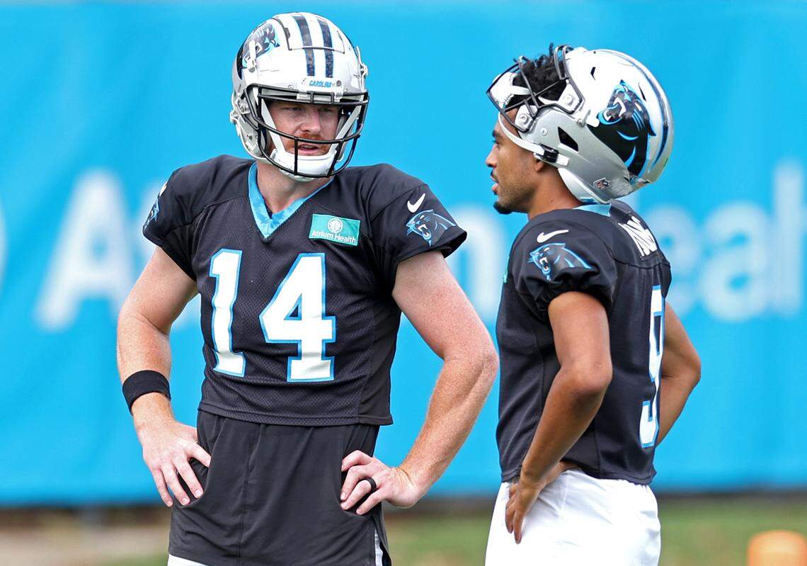 Carolina Panthers quarterbacks Andy Dalton, left and Bryce Young, right, talk during practice on Wednesday, September 25, 2024.