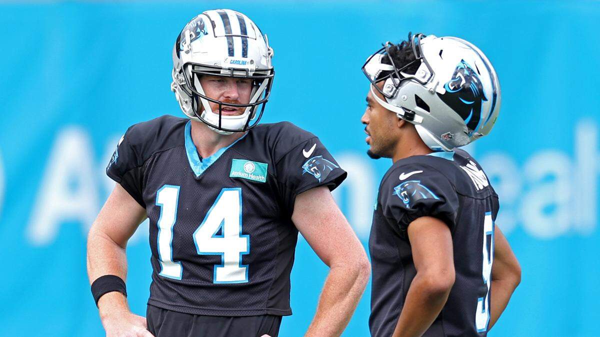 Carolina Panthers quarterbacks Andy Dalton, left and Bryce Young, right, talk during practice on Wednesday, September 25, 2024.