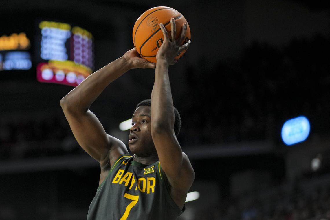 Feb 25, 2025; Cincinnati, Ohio, USA;  Baylor Bears guard VJ Edgecombe (7) controls the ball against the Cincinnati Bearcats in the second half at Fifth Third Arena. Mandatory Credit: Aaron Doster-Imagn Images