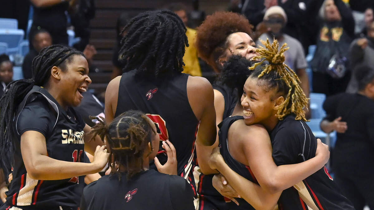 Members of the Salisbury girls basketball team celebrate their 48-39 victory over Seaforth at the Dean Smith Center on Saturday, March 11, 2023.