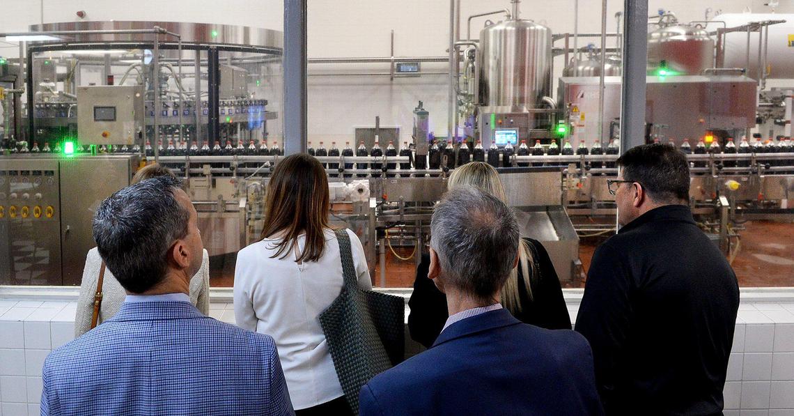 NC Chamber members watch the bottle-filling process at the Snyder Production Center at Coca-Cola Consolidated in Charlotte during a March 19, 2025, tour.
