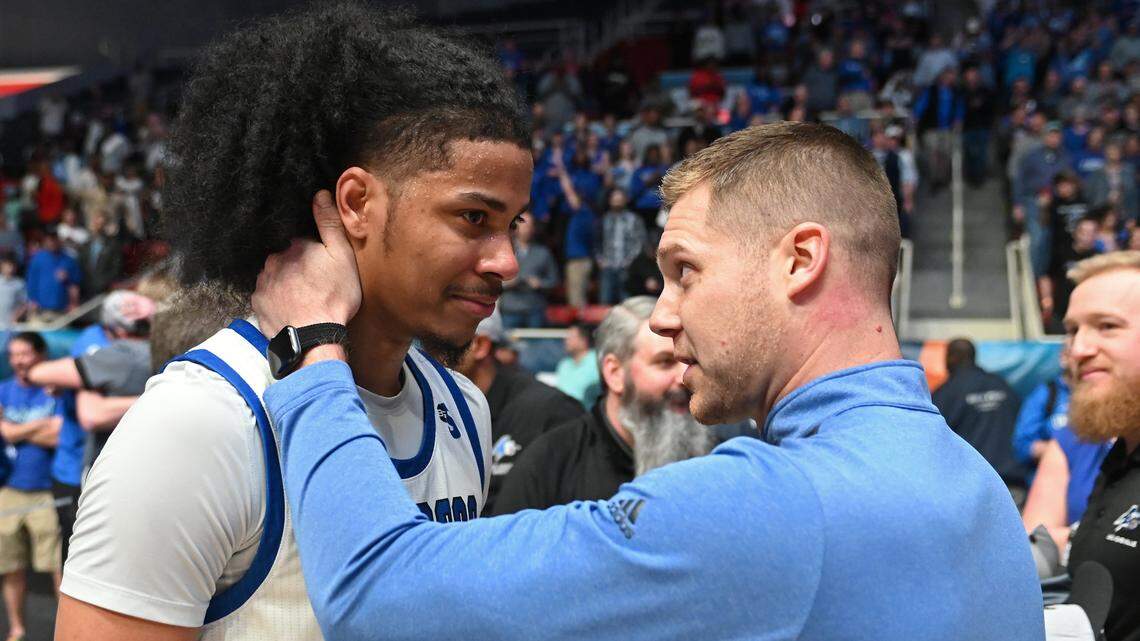 UNC Asheville’s Tajion Jones cries tears of joy as head coach Mike Morrell, right, speaks to him following the team’s 77-73 win in the 2023 Hercules Tires Big South Men’s Basketball Championship game against Campbell on Sunday, March 5, 2023 at Bojangles Coliseum in Charlotte, NC.