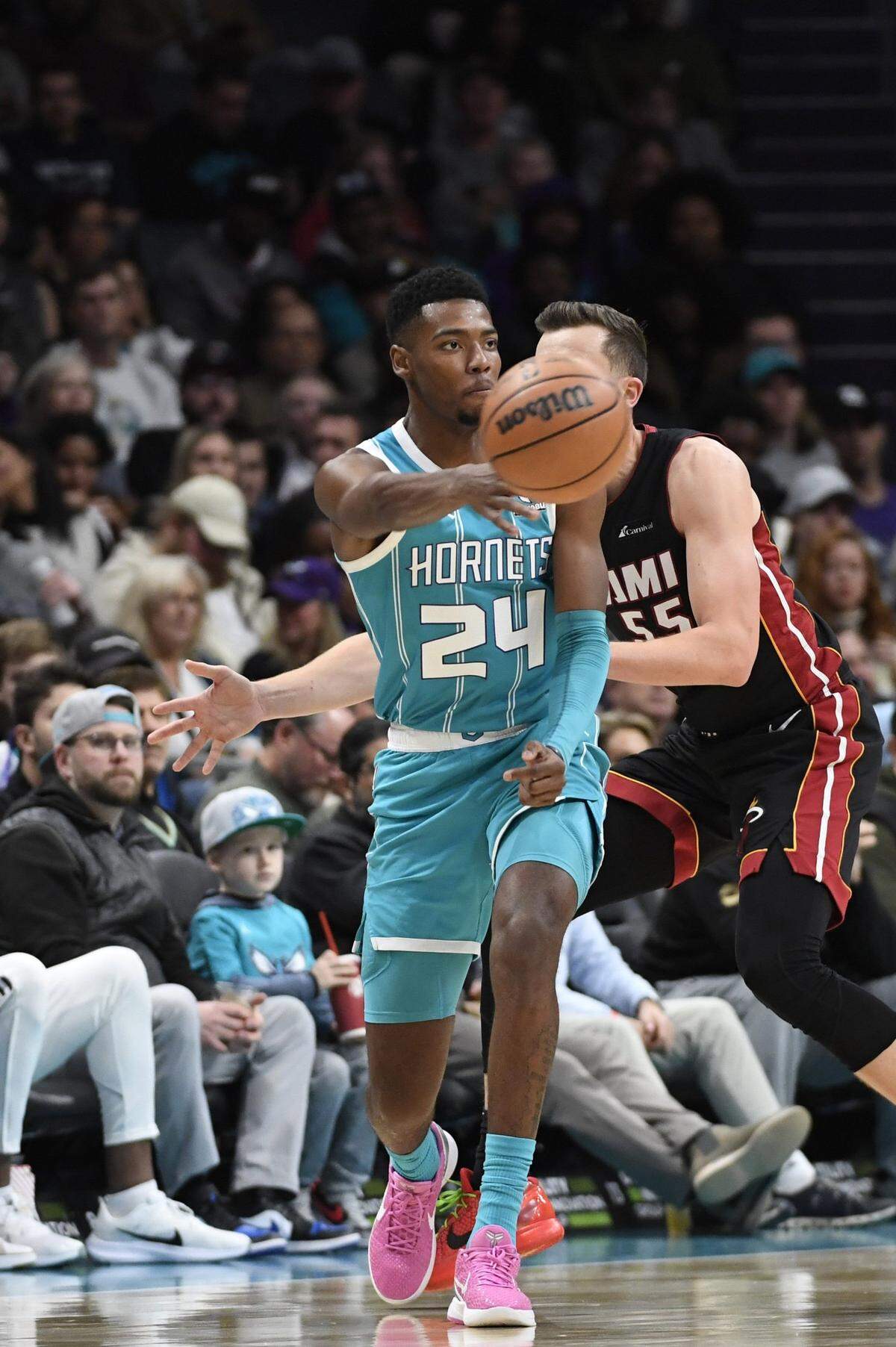 Charlotte Hornets forward Brandon Miller (24) passes during the first half against the Miami Heat at the Spectrum Center.