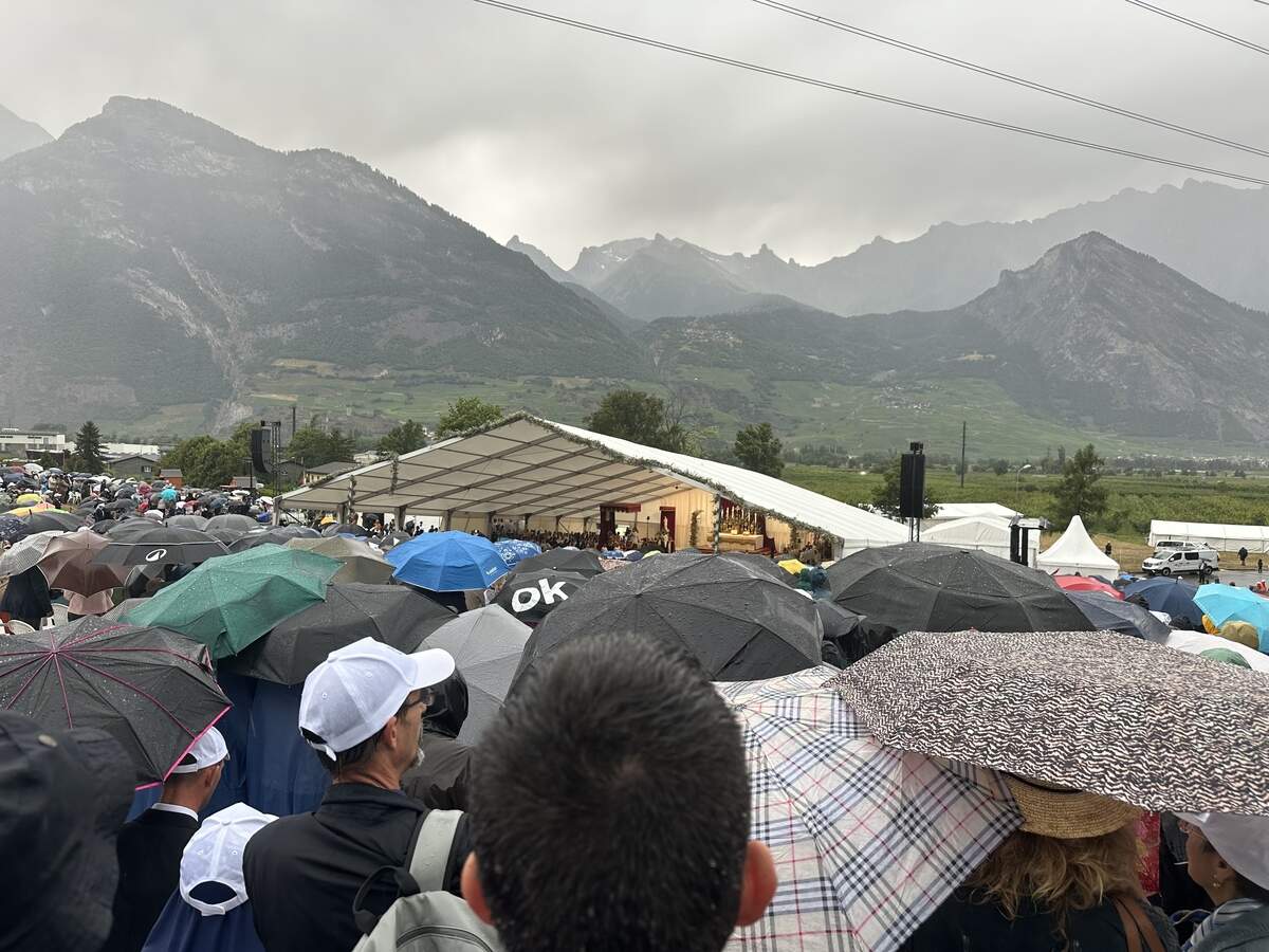 Thousands of Catholics wait out the rain in Switzerland on Wednesday, where the Society of St. Pius X consecrated four new bishops against the pope’s orders.