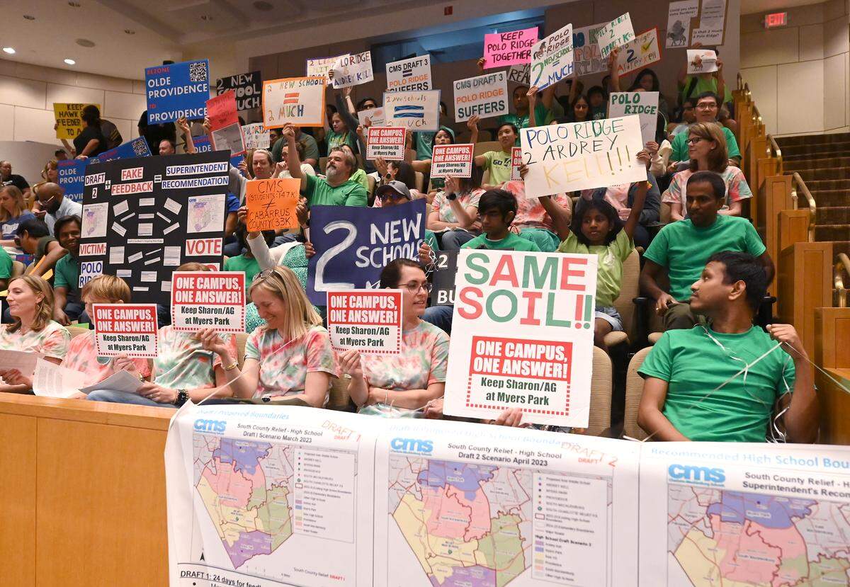 Signs were prevalent among the parents attending the Charlotte-Mecklenburg Board of Education meeting on Tuesday, June 6, 2023 where the south Charlotte boundaries vote was on the agenda.