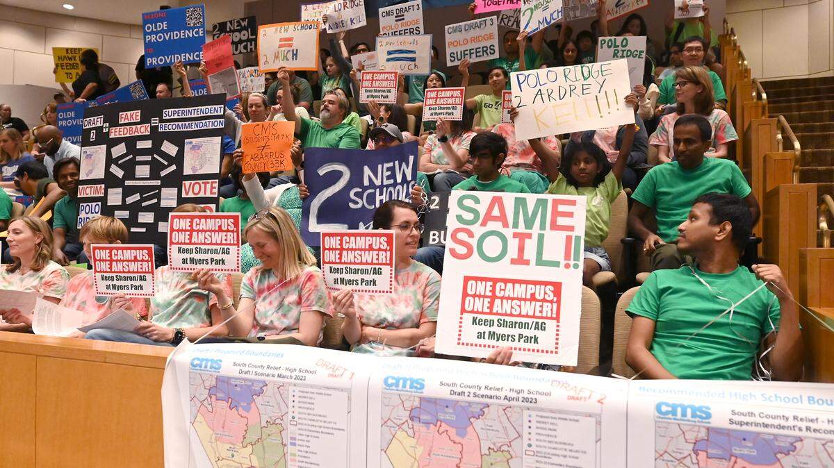 Signs were prevalent amongst the parents attending the Charlotte-Mecklenburg Board of Education meeting on Tuesday, June 6, 2023 where the south Charlotte boundaries vote was on the agenda.